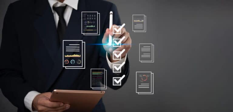 Image is of a business professional reviewing digital documents and compliance reports on a tablet, concept of data verification and WA checks